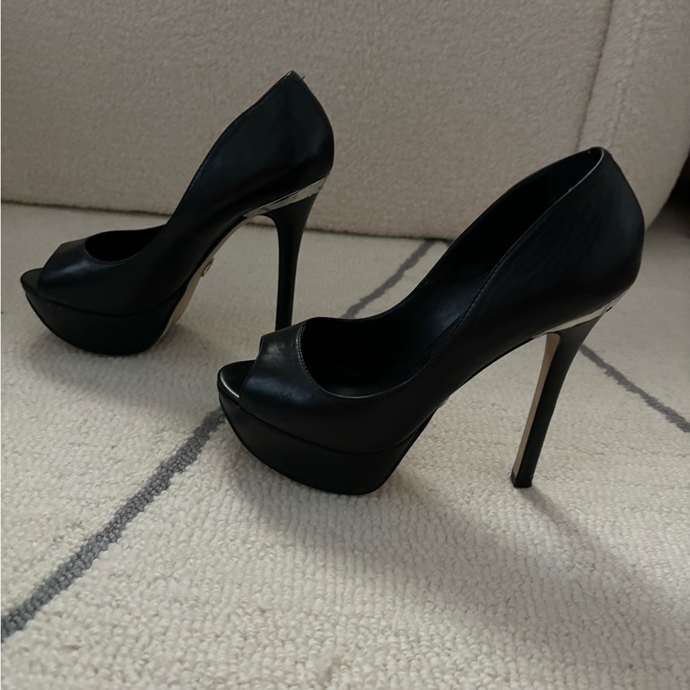 Bebe black heels with silver on the back heel